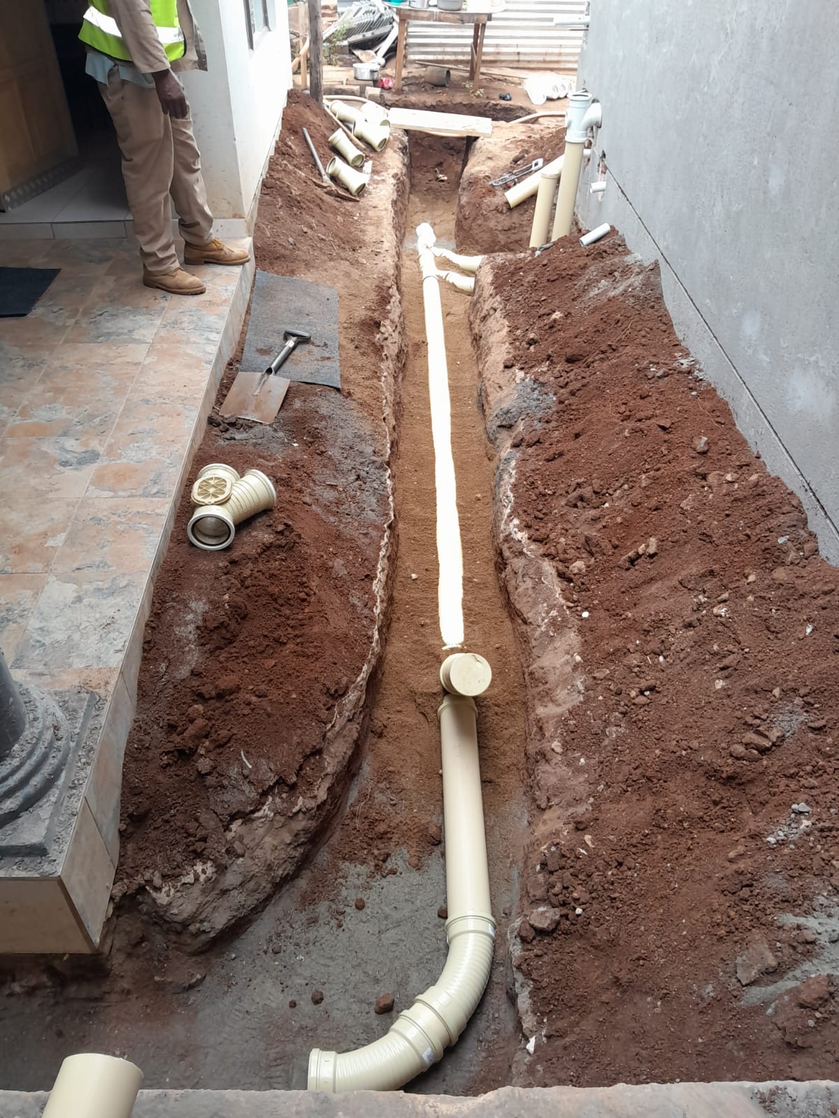 Drain cleaning & pipe re-routing
